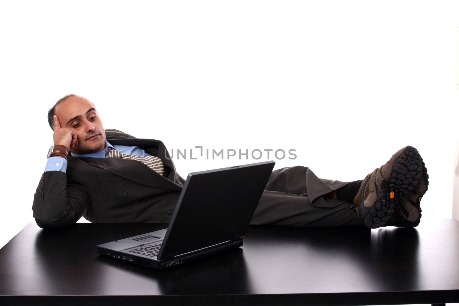 businessman working on laptop by jpcasais
