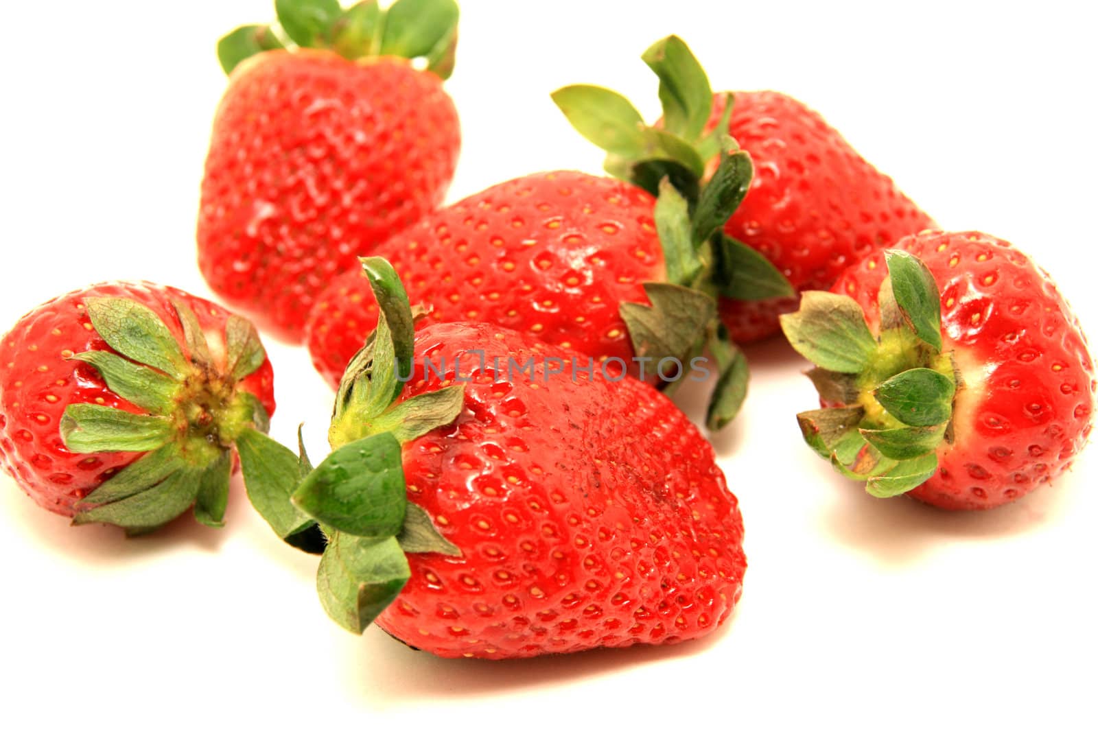 beautiful strawberries over white background