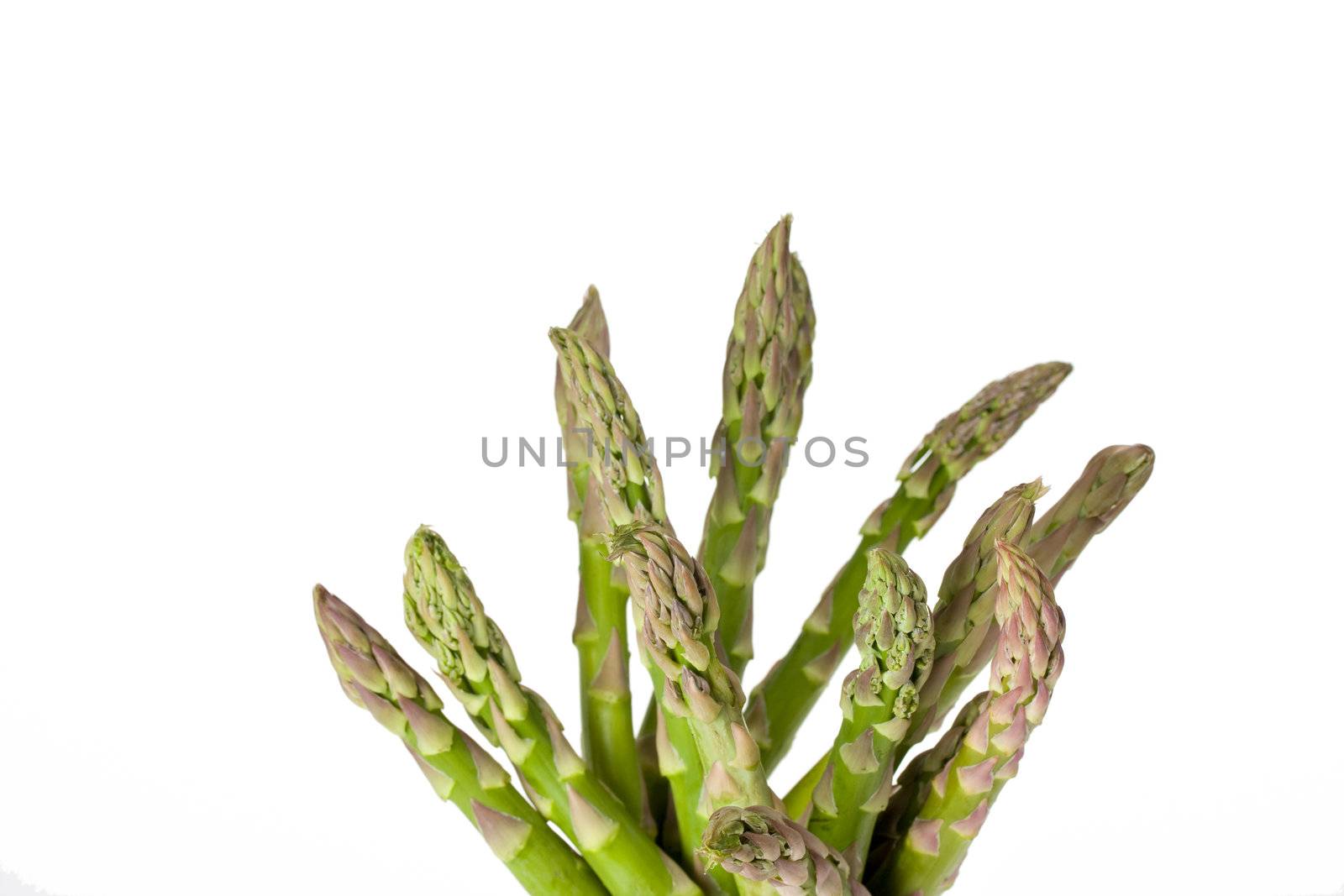 detail of fresh green asparagus isolated on white background by bernjuer