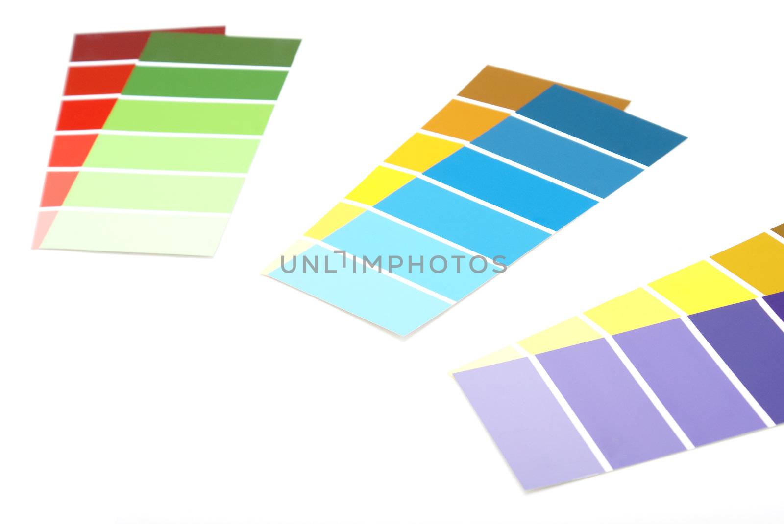 A few colorful paint samples on white background.