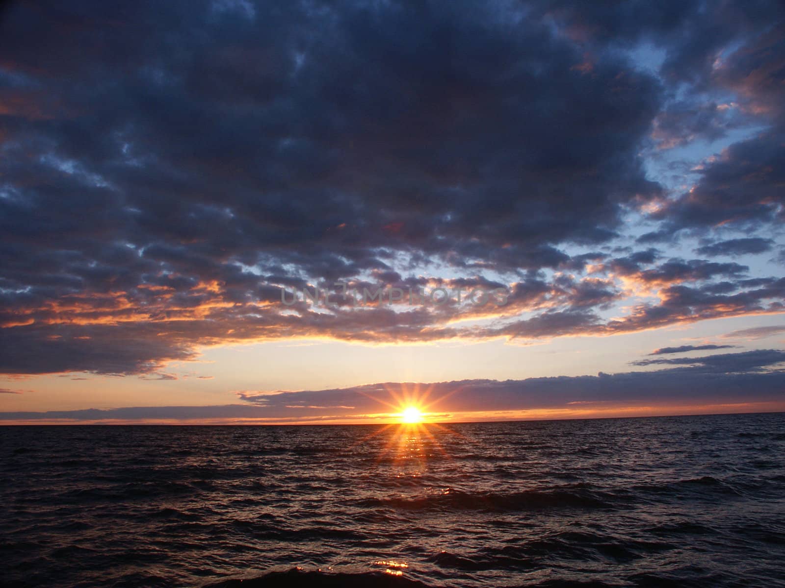 The sun sets over beautiful Lake Superior in northern Michigan.