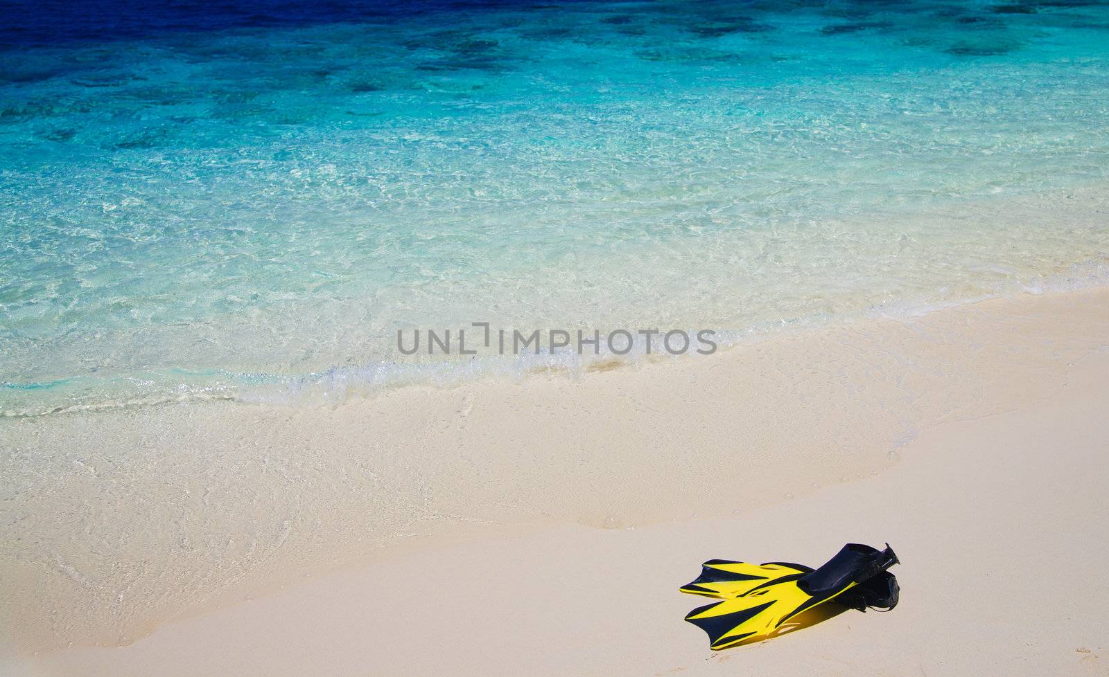 snorekl equipment on white sand beach at Maldives