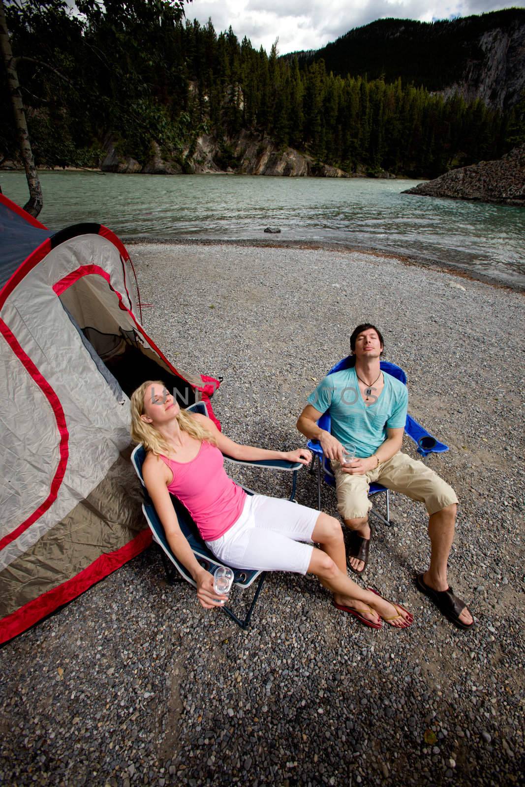 Couple Relaxing while Camping by leaf