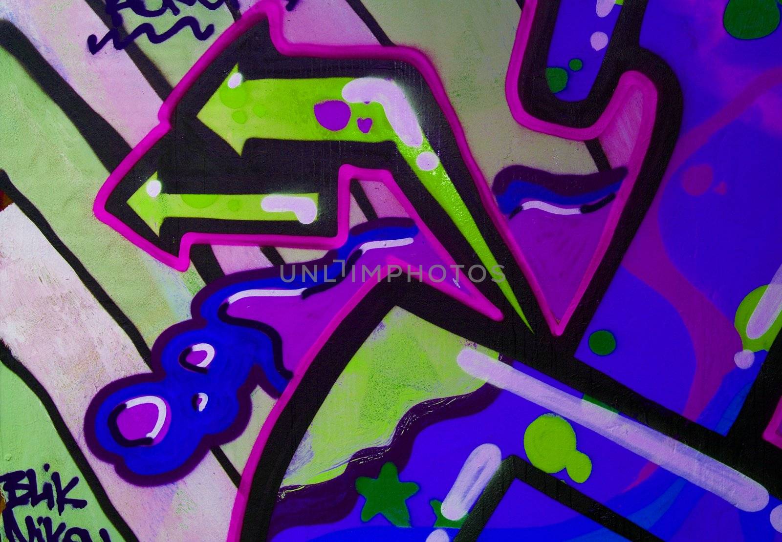 colorful graffiti painted on a concrete wall
