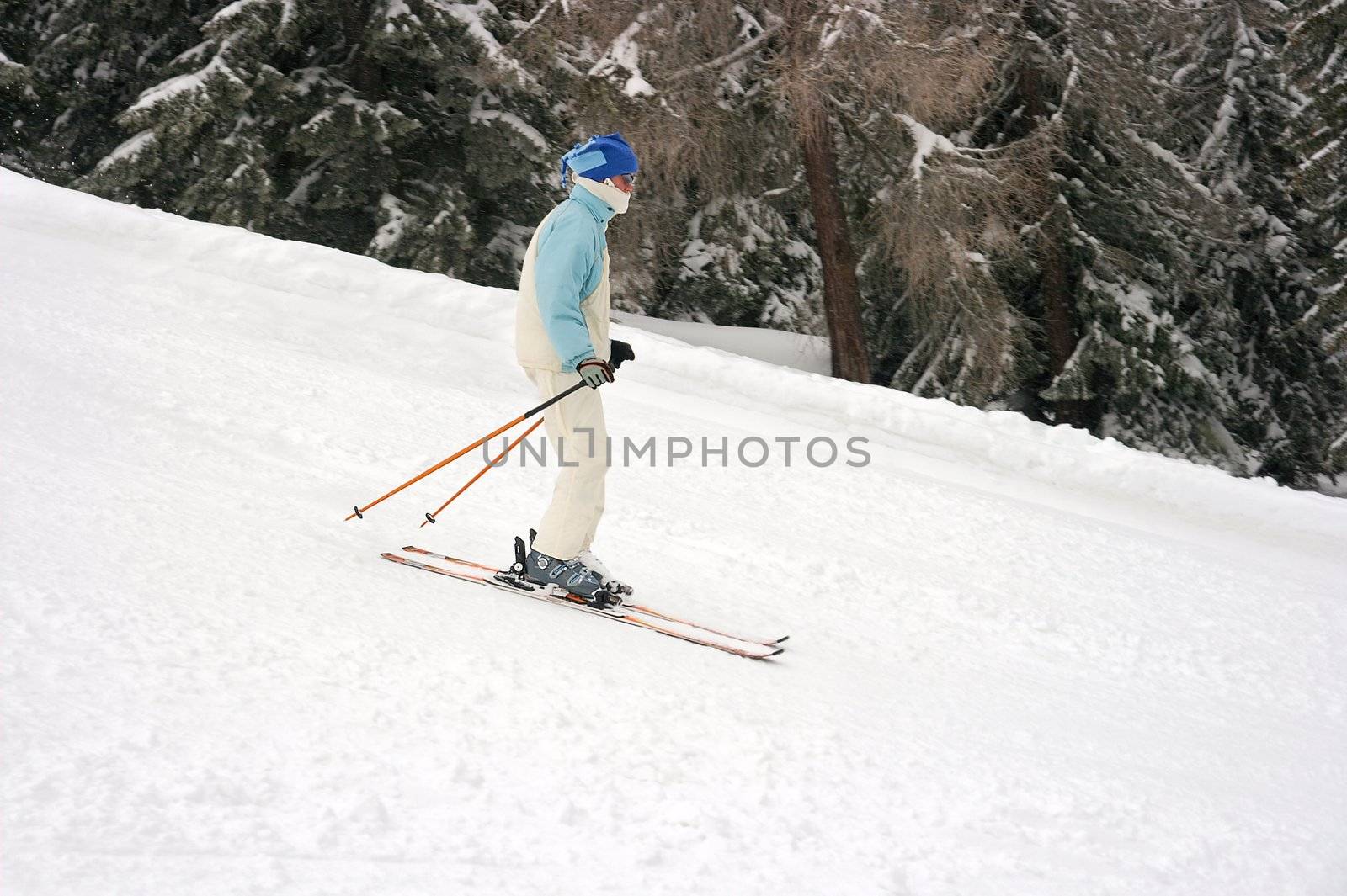 Female skier going down the slope