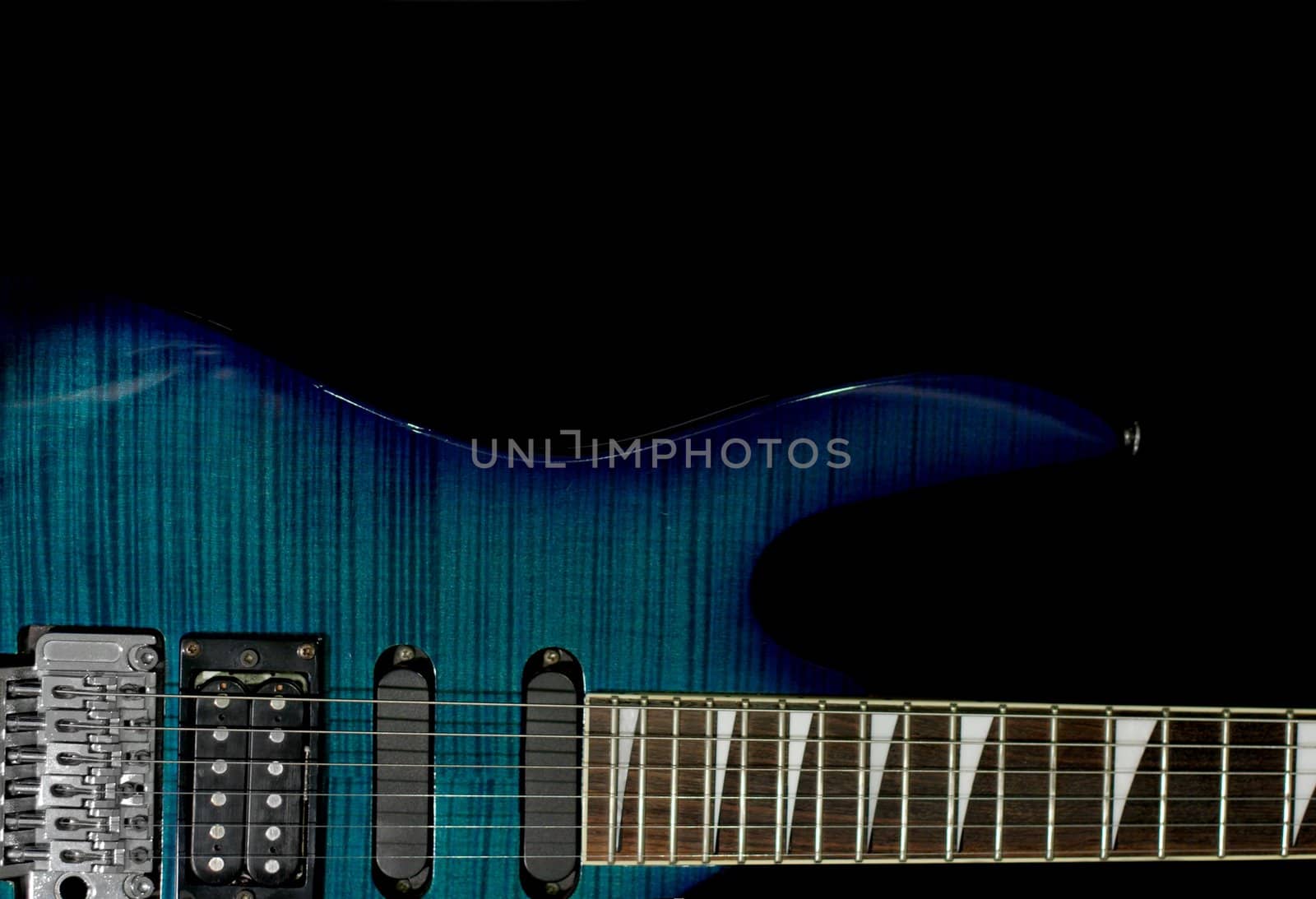 Detail of an electric guitar isolated on black