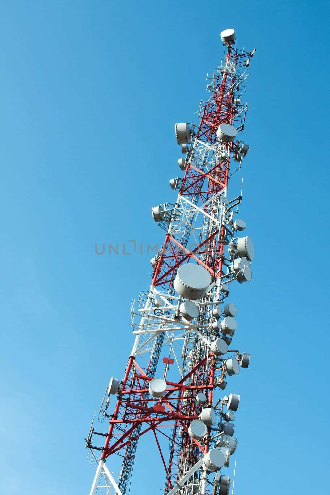 Communication transmitter tower against clear blue sky