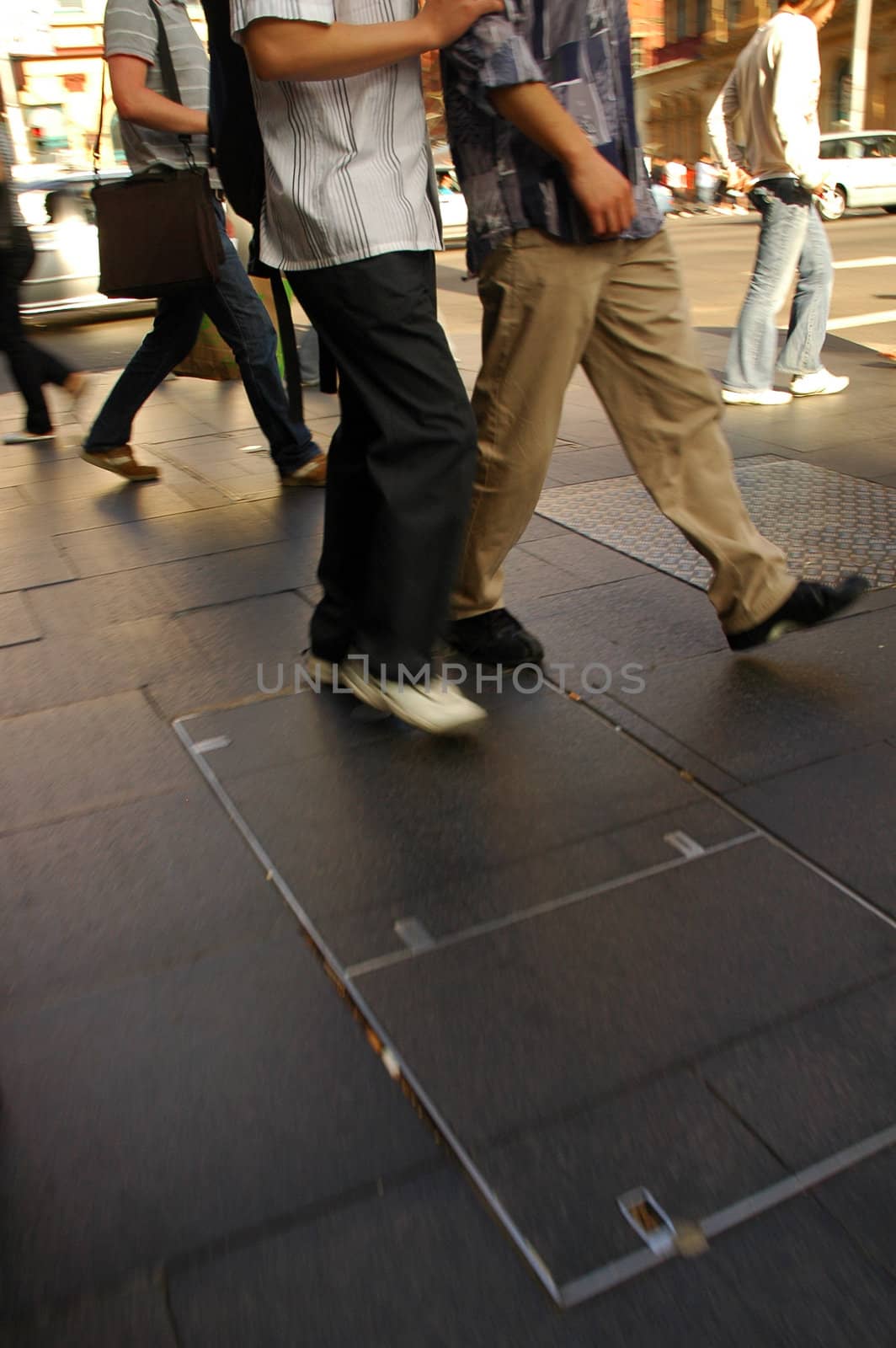detail photo of several pedestrian feet, motion blur