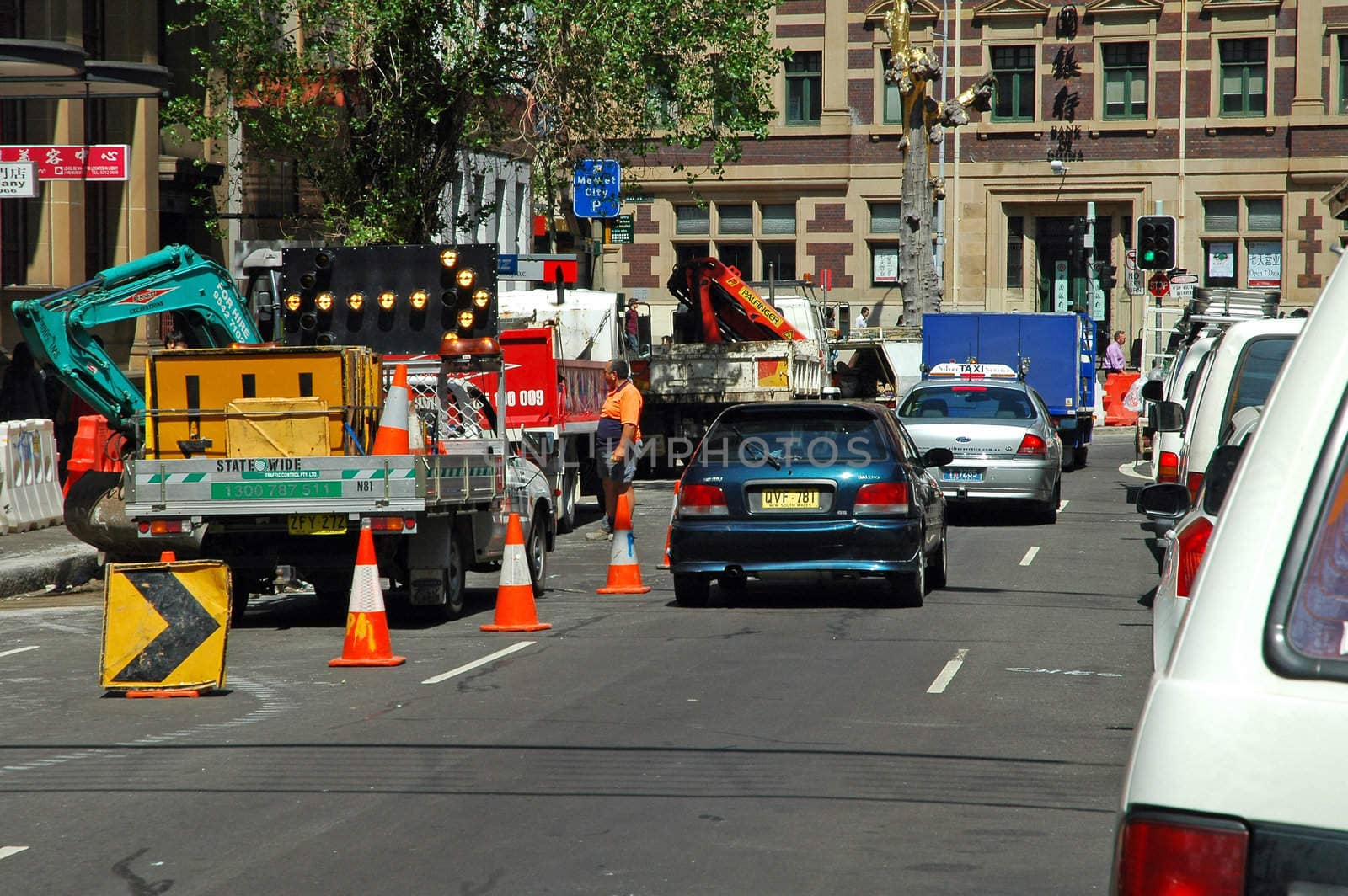 road construction bloking traffic, jam, several cars