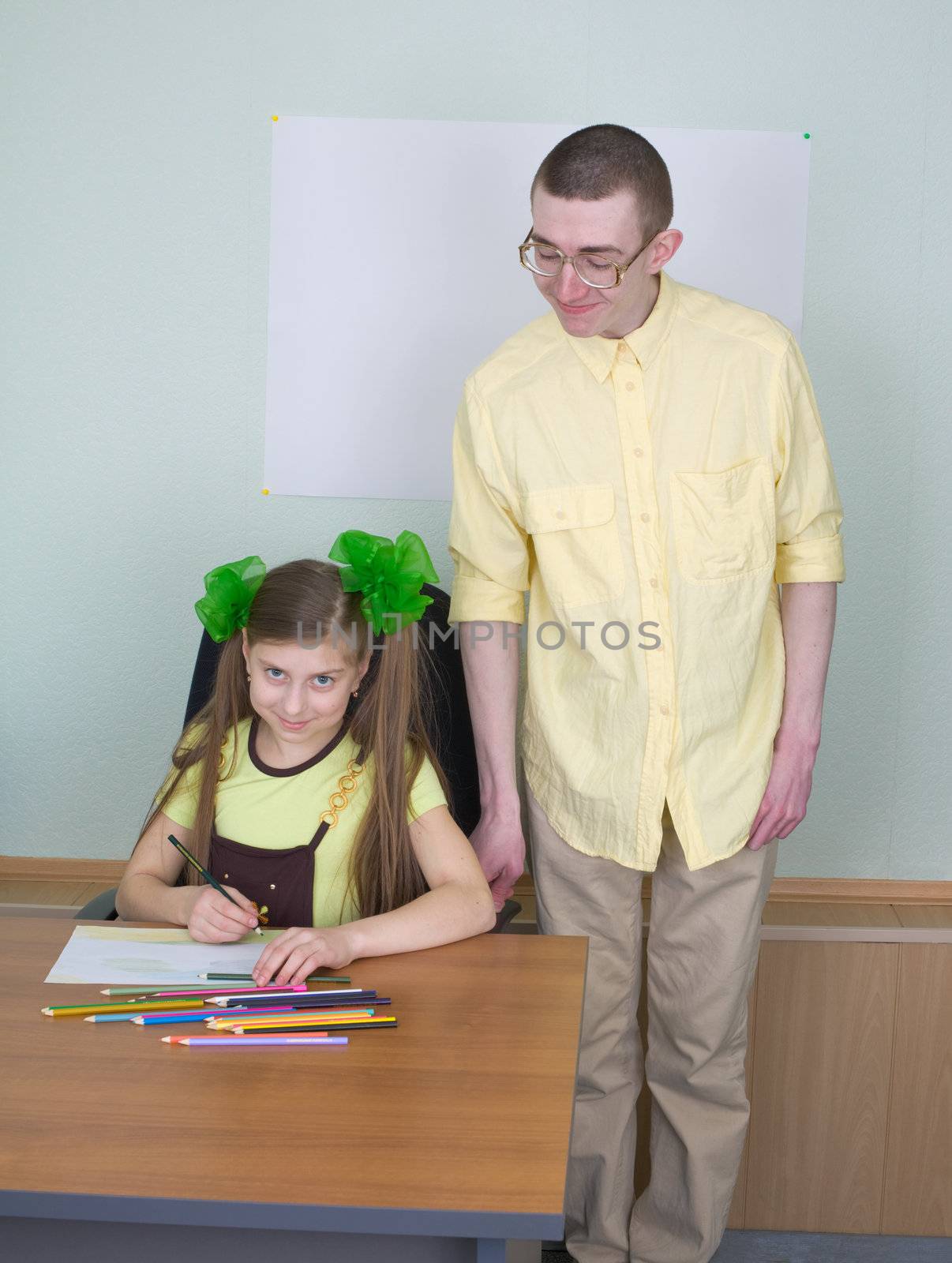 The girl and brother with color pencils