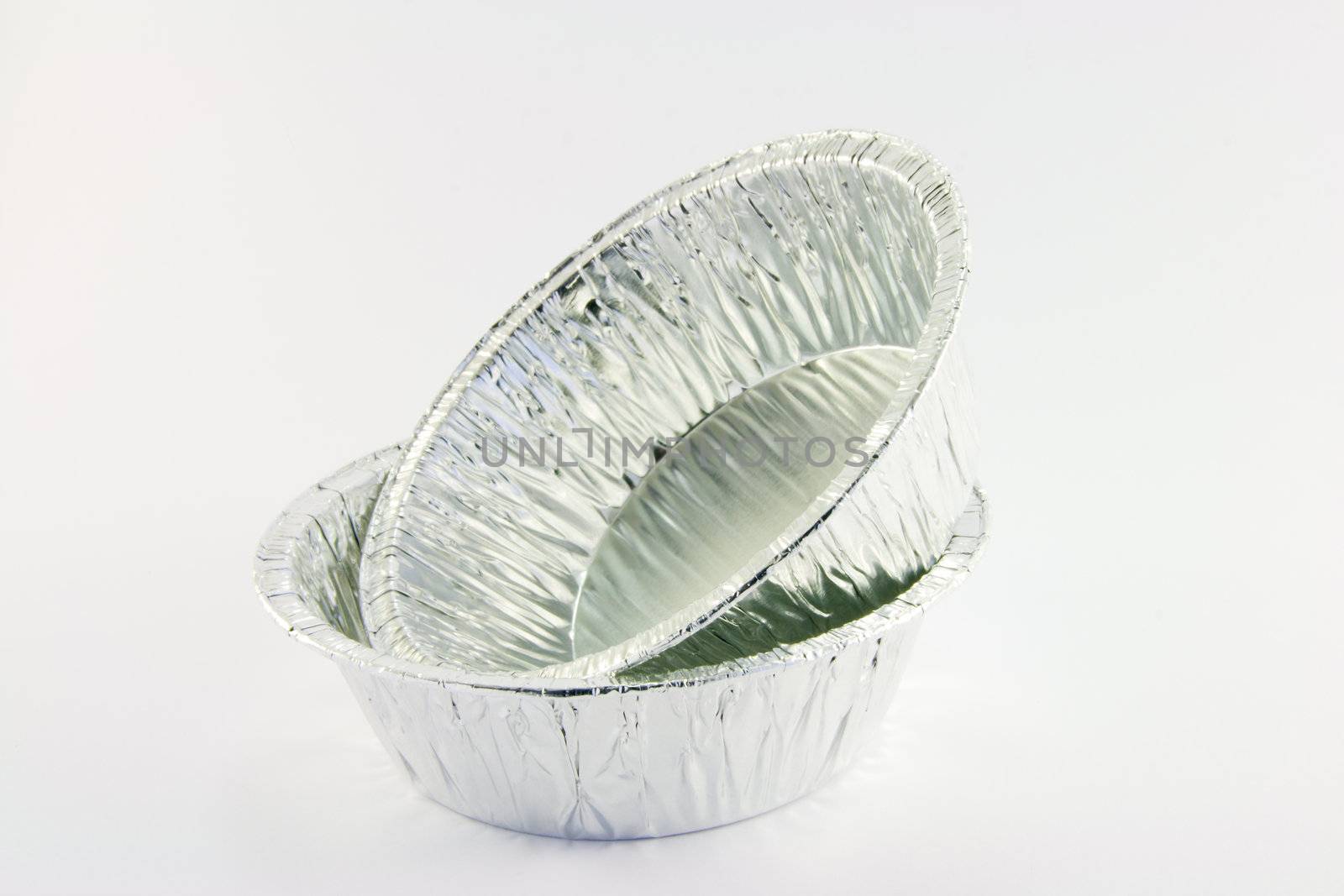 Two small round foil catering trays on a white background