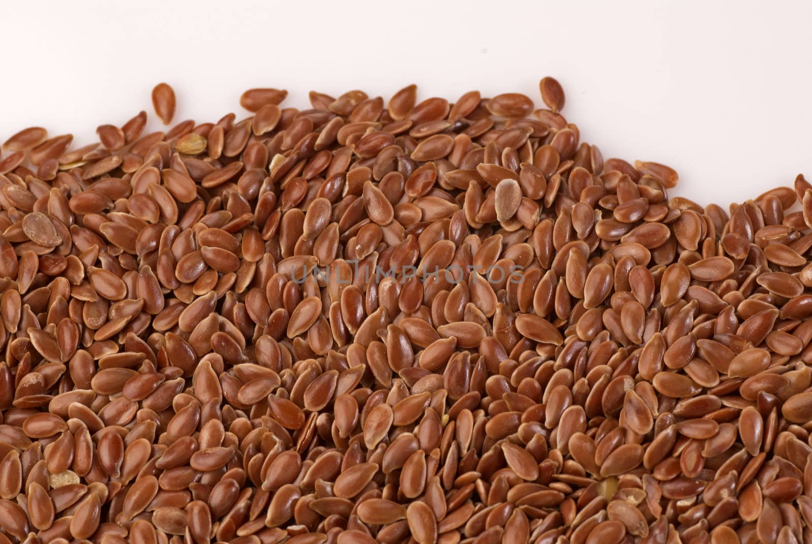 A heap of organic linseed, food background