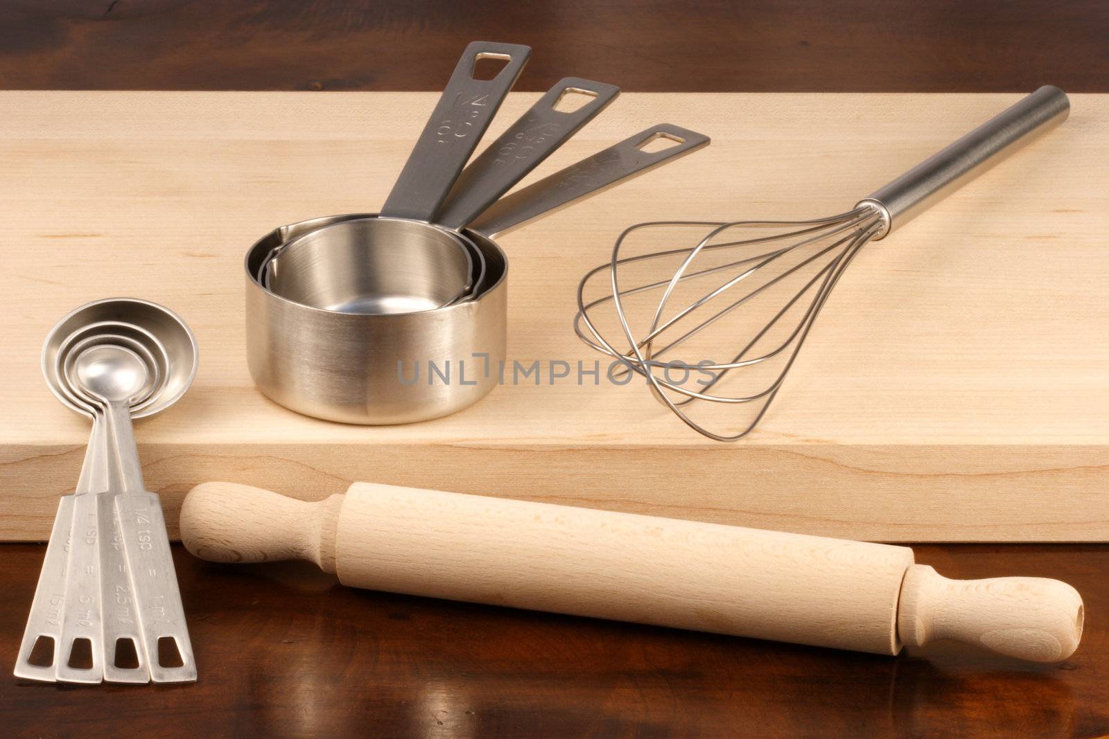kitchen utensils over wood  by tacar