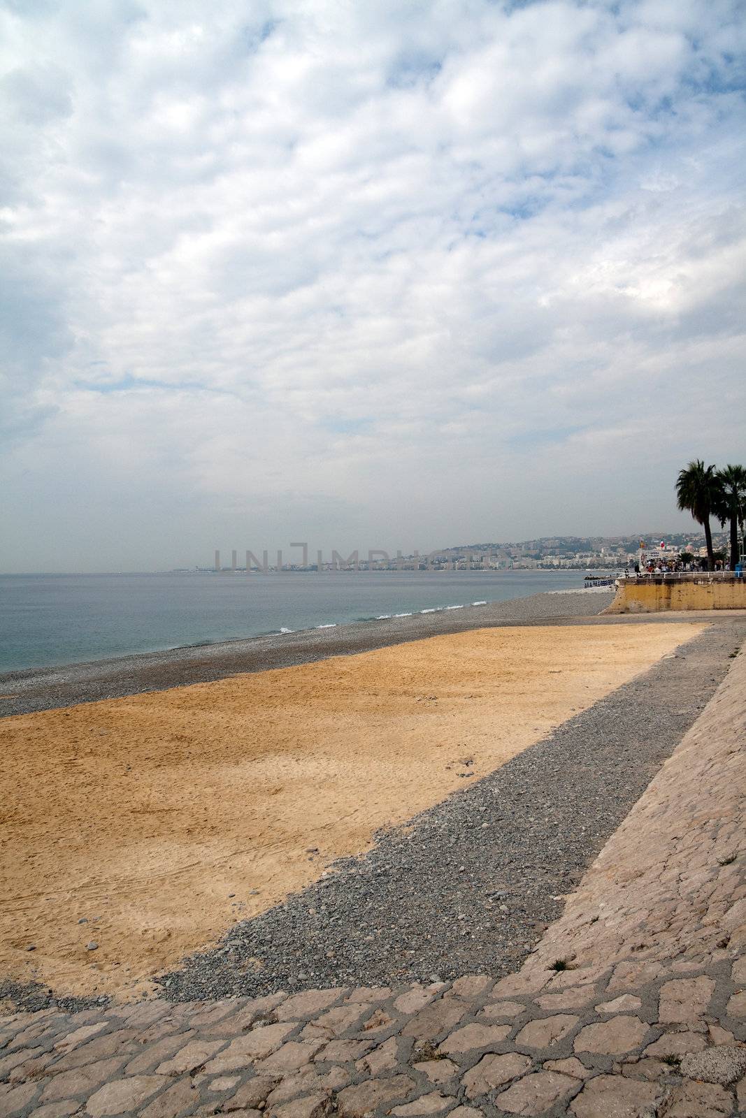 The sandy and rocky beach in Nice, France