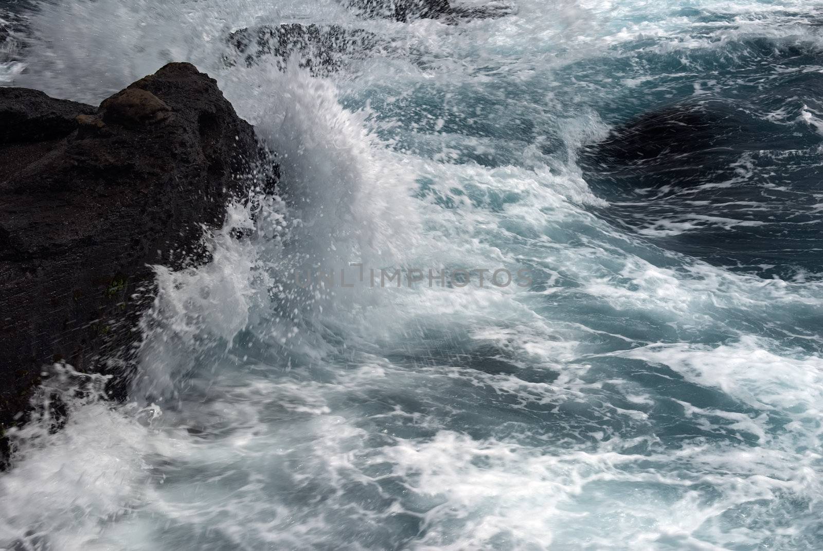 waves beating the rock by elwynn