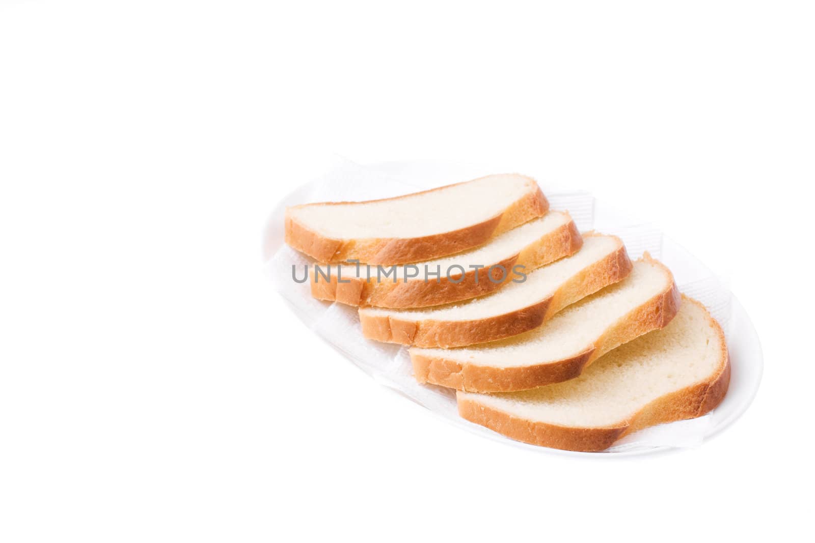 Sliced Bread on the plate isolated over white. Bon appetit!