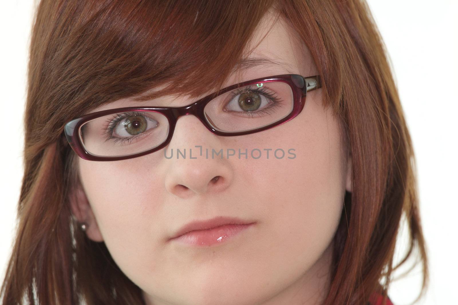 Portrait of young beautiful female teenager in glasses isolated on white background