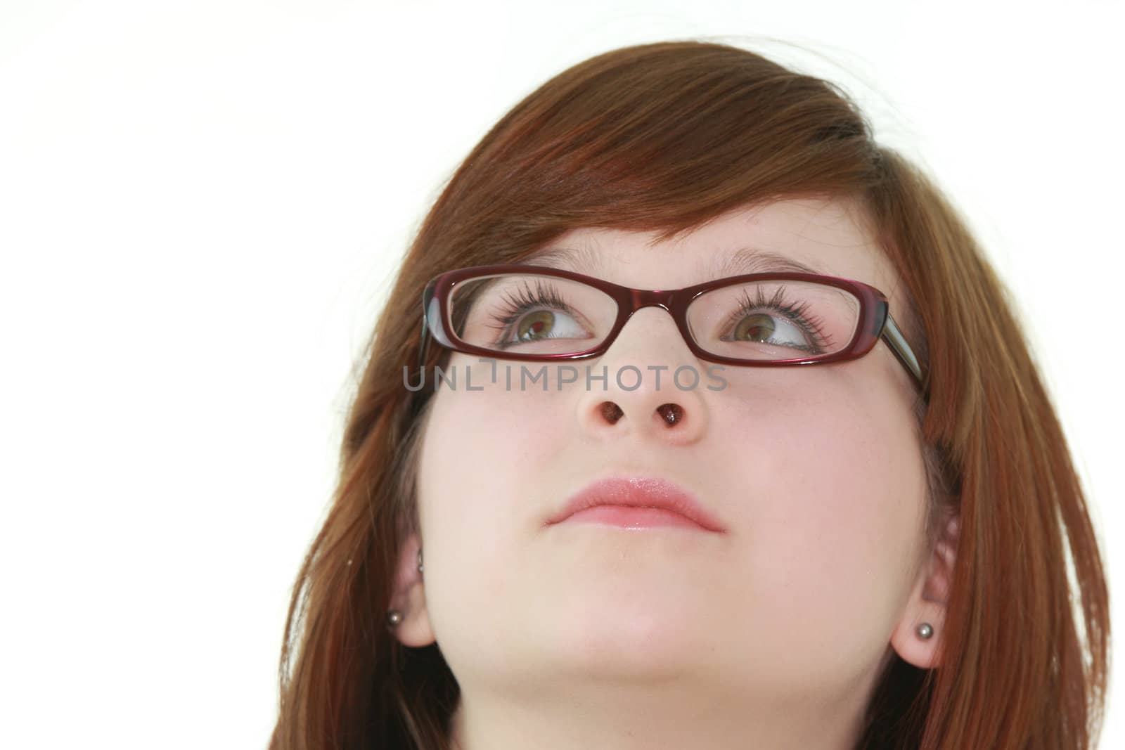 Portrait of young beautiful female teenager in glasses isolated on white background