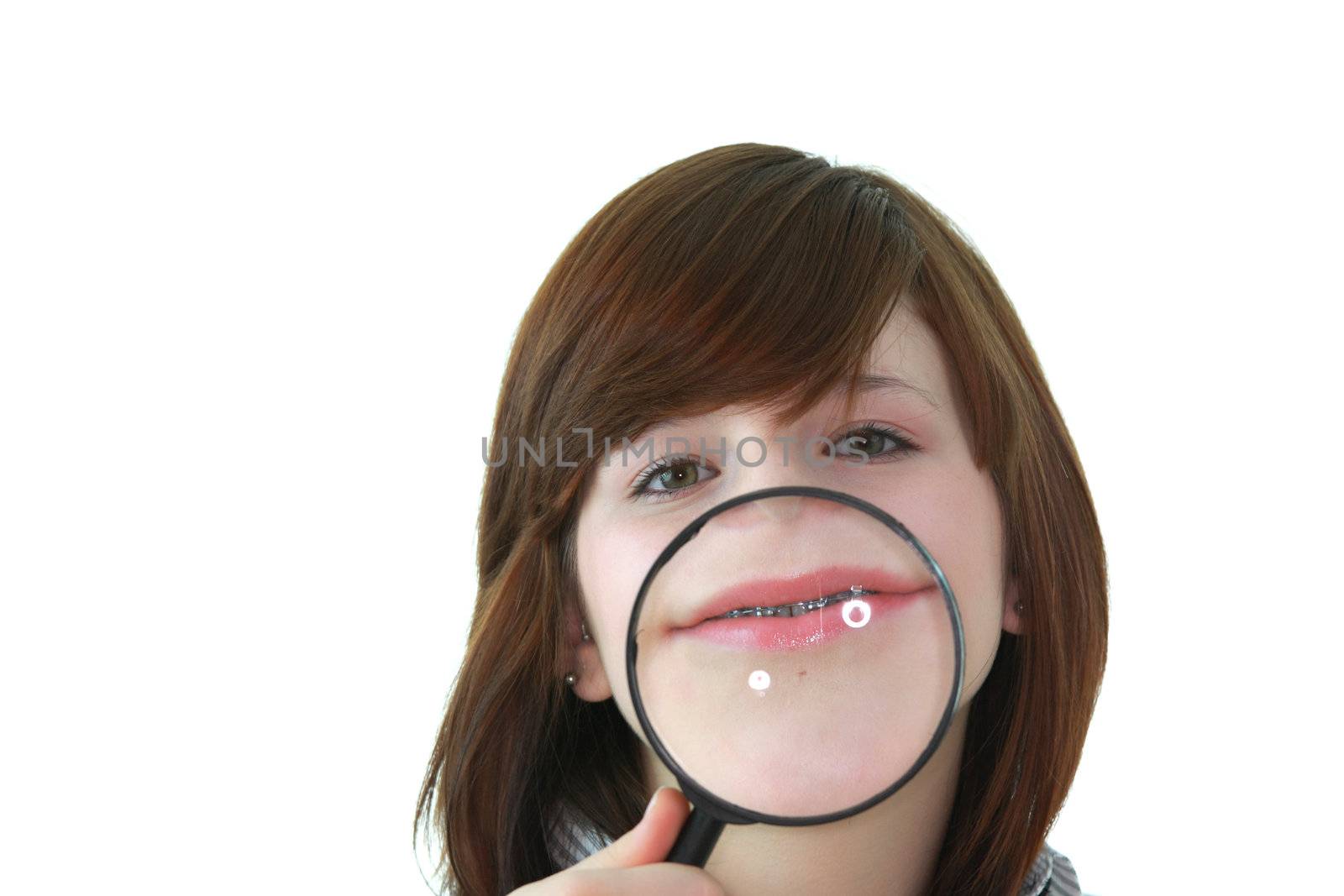 Young student with magnifier isolated on white background