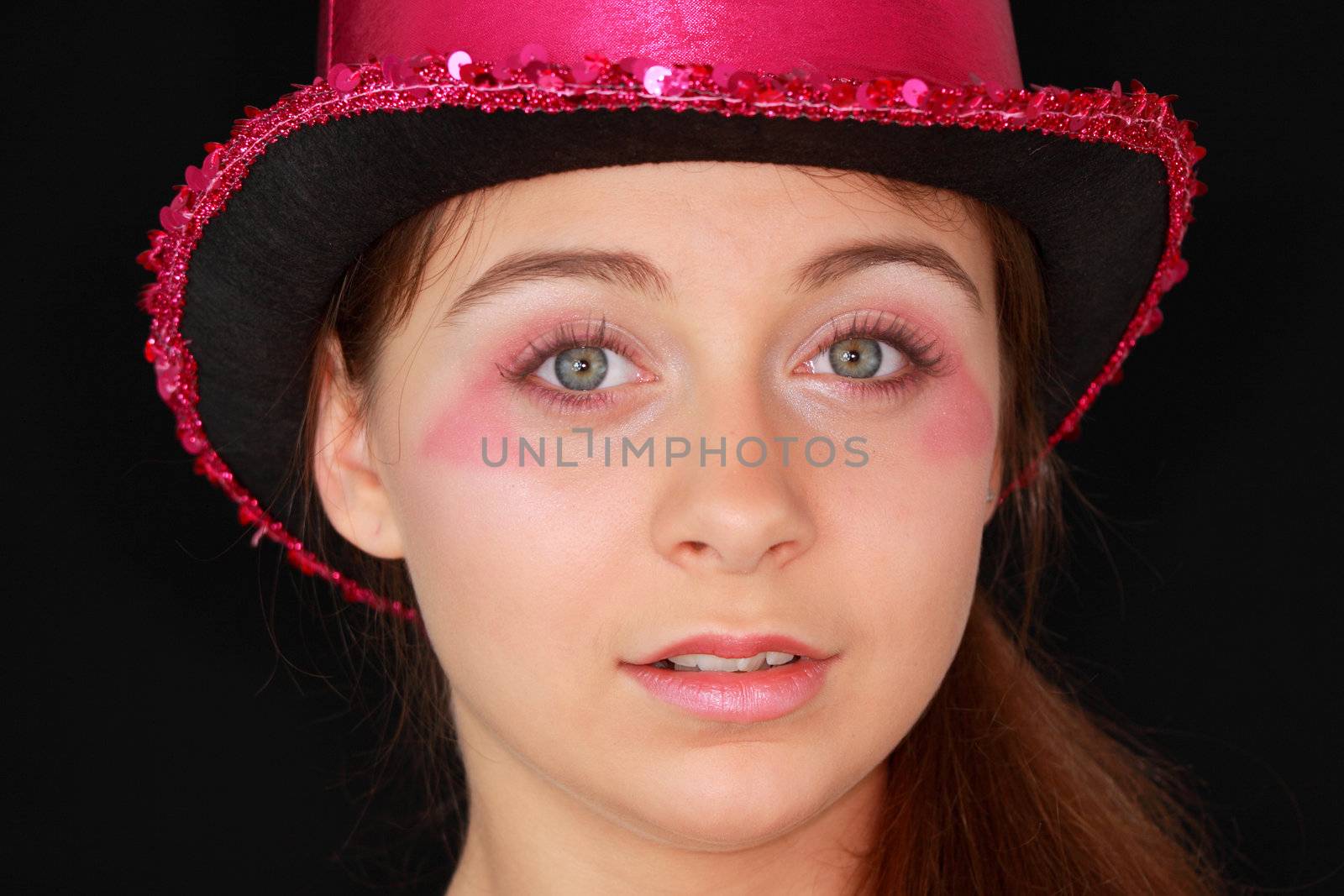 Portrait of a beautiful young girl in pink disco hat - carnival theme