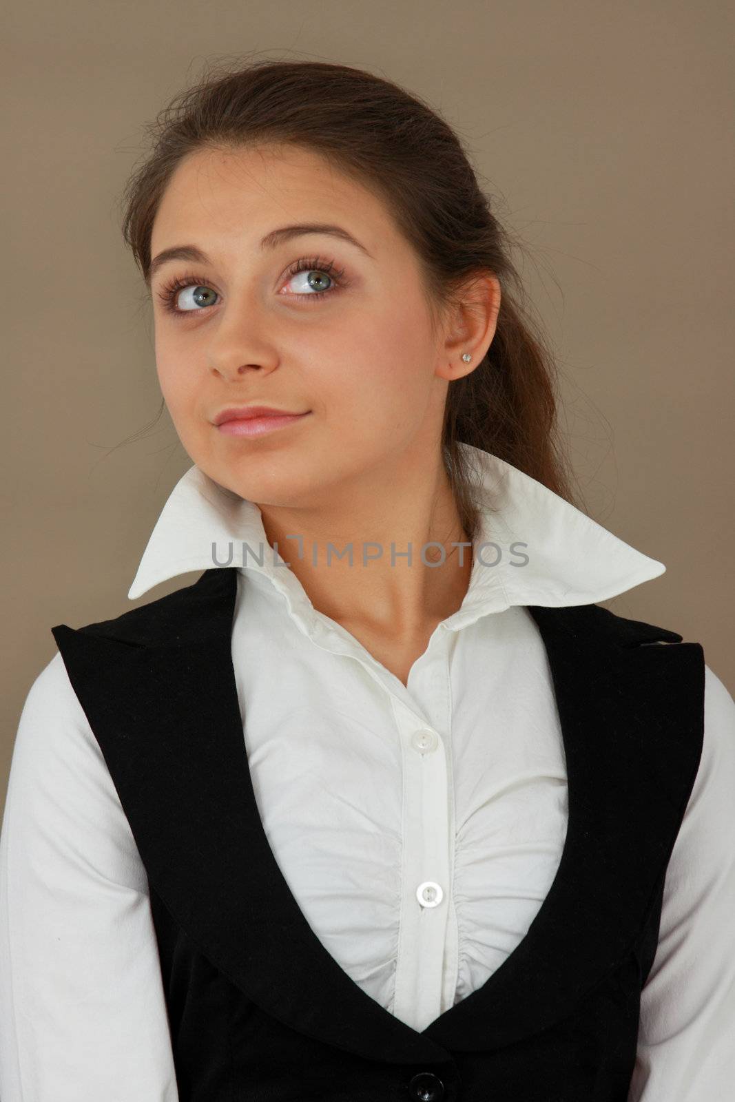 Student girl over light brown background