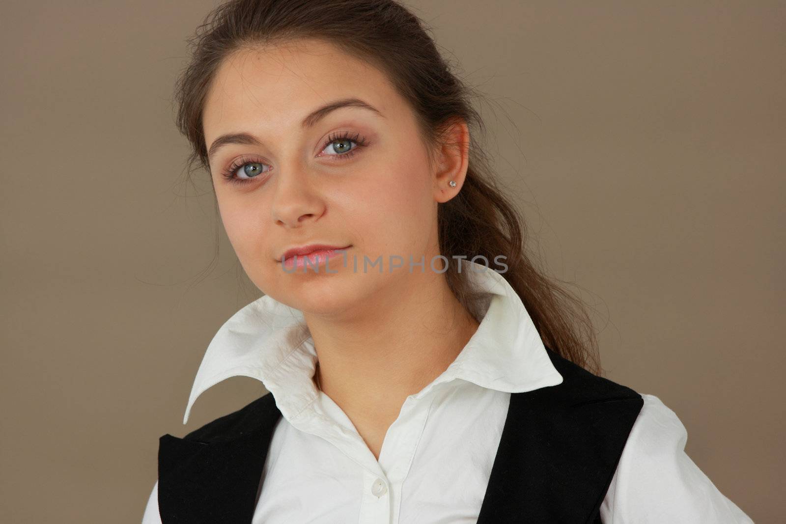 Student girl over light brown background