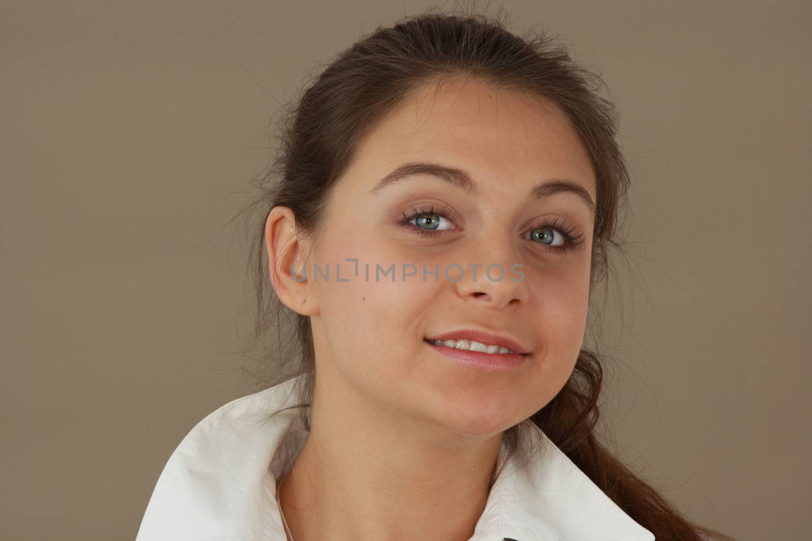 Student girl over light brown background