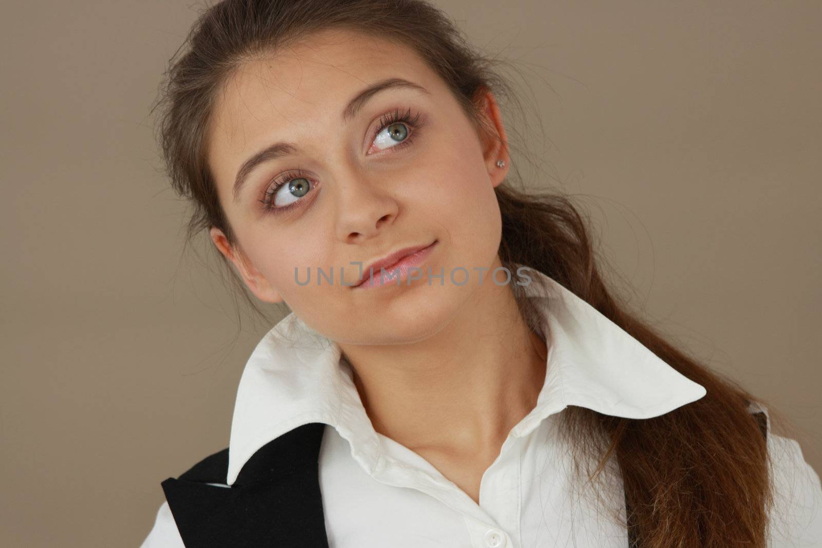 Student girl over light brown background