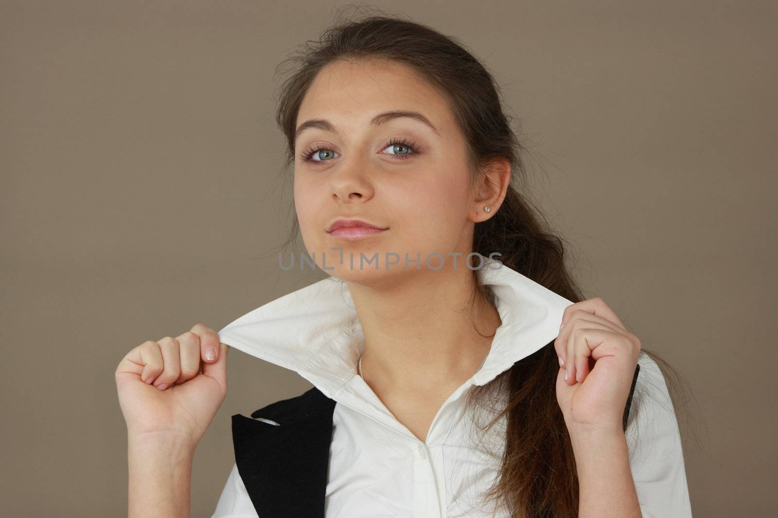 Student girl over light brown background