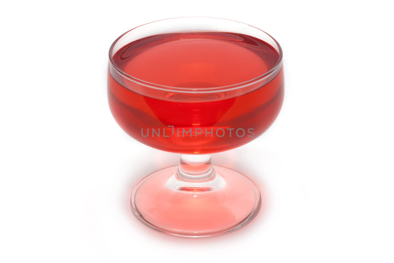 Red jelly in transparent glass, transparent, on white background