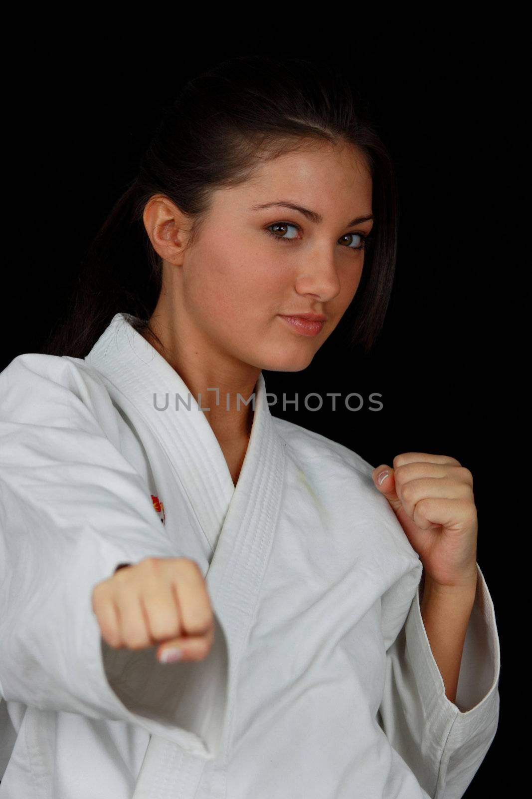 Beautiful young teen in karate suit