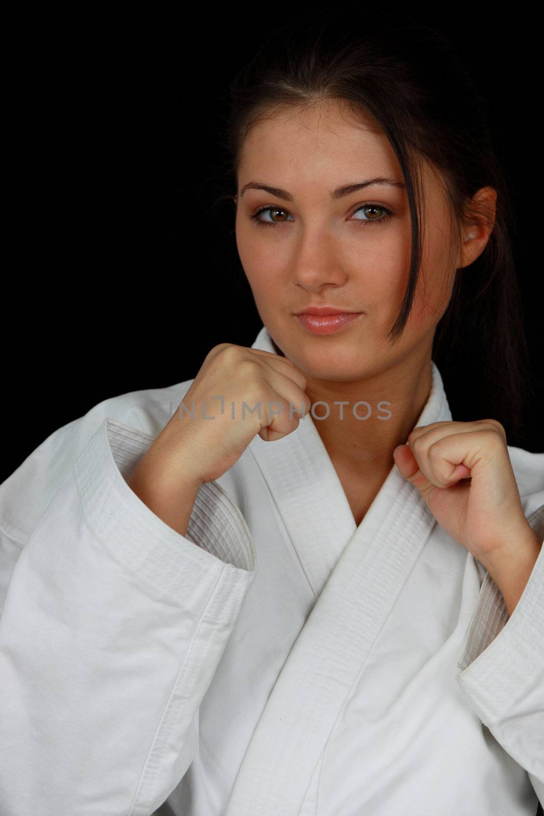 Beautiful young teen in karate suit