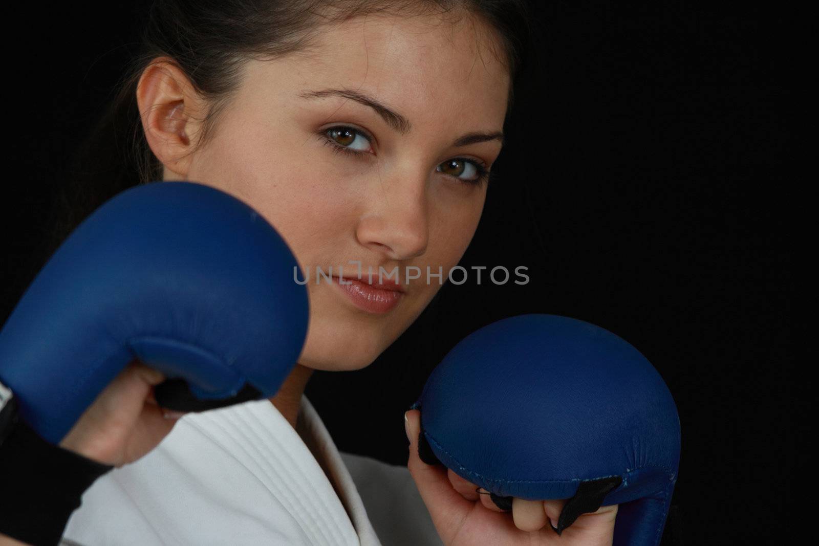 Beautiful young teen in karate suit