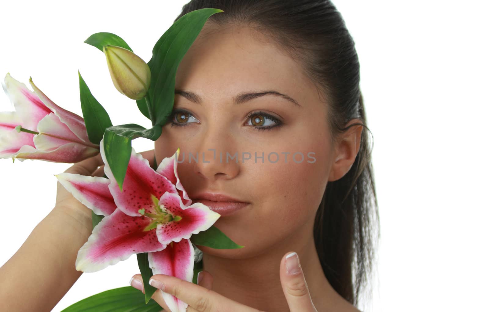 Portrait of young attractive woman with beautiful lilly flower