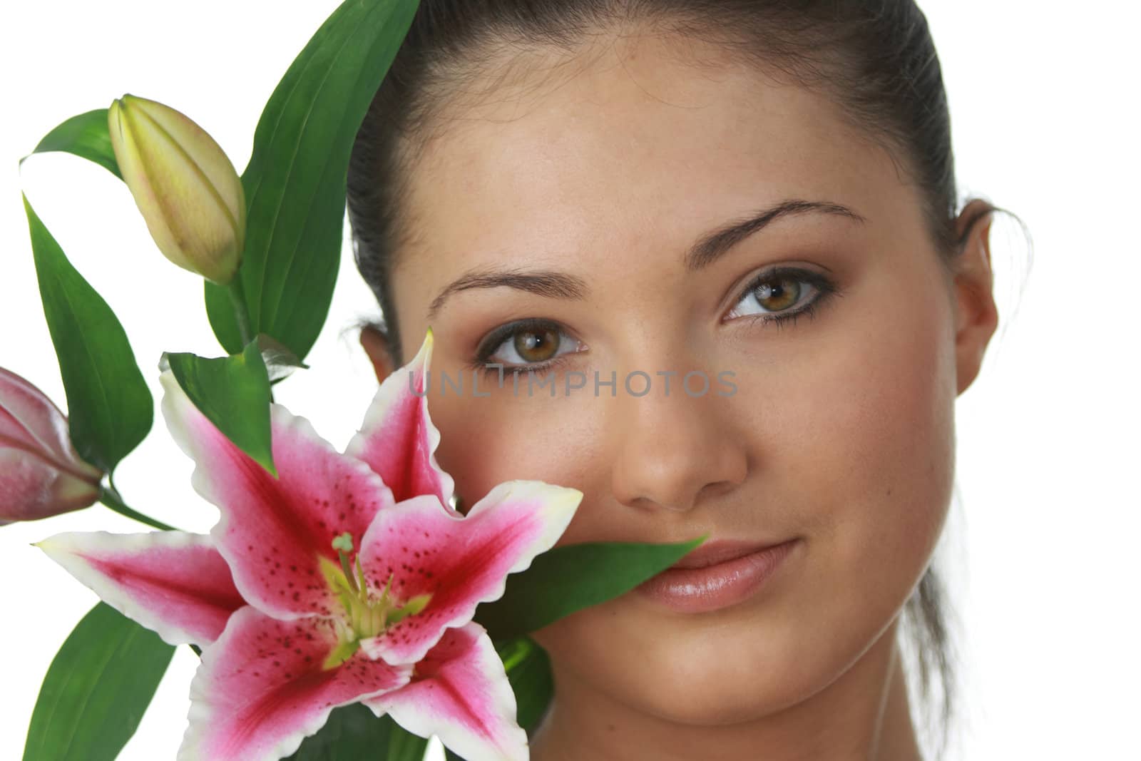 Portrait of young attractive woman with beautiful lilly flower