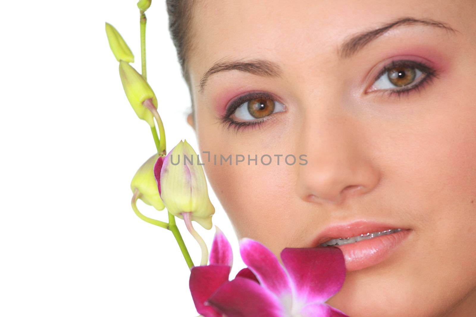 Beauteful spa girl with orchid isolated on white background