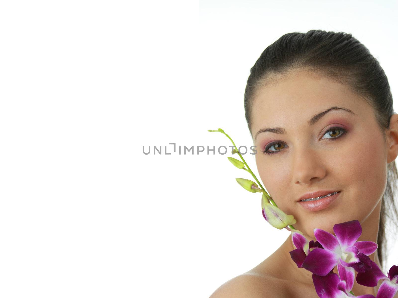 Beauteful spa girl with orchid isolated on white background