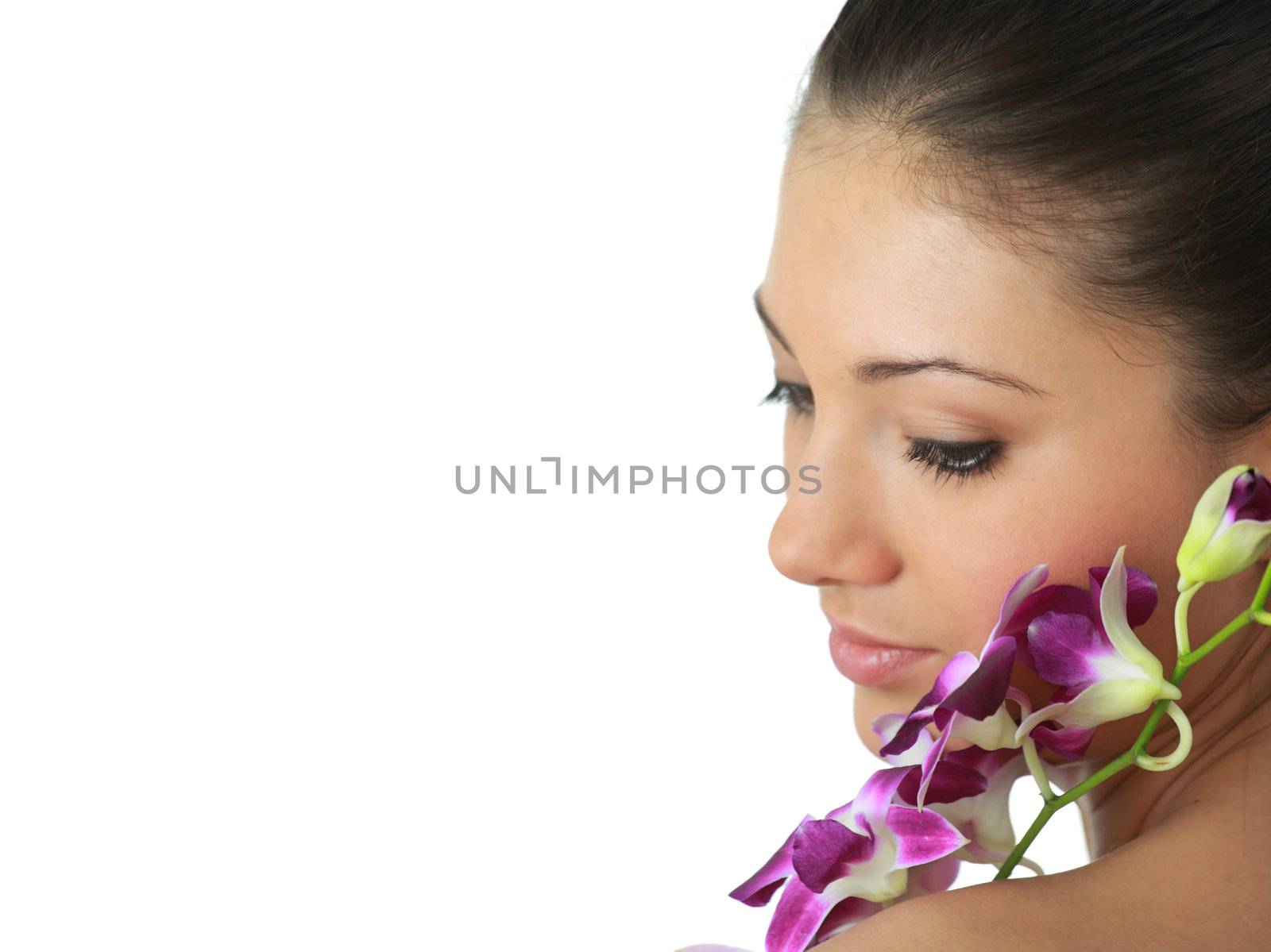 Beauteful spa girl with orchid isolated on white background