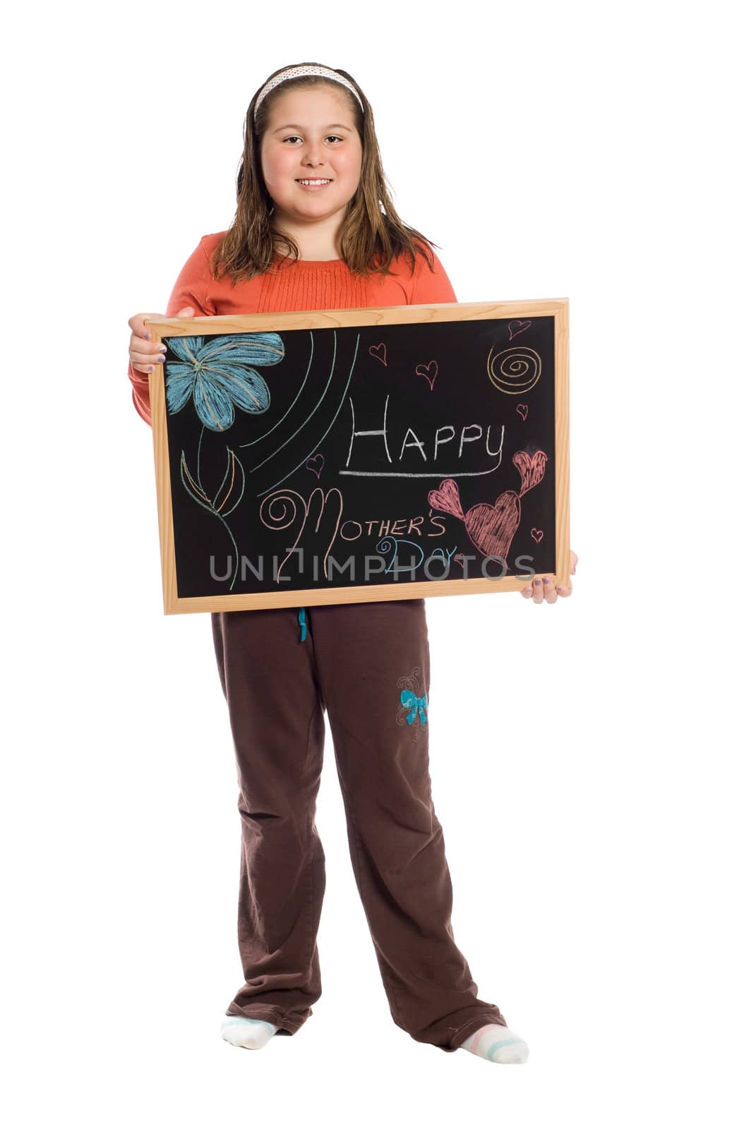 A young girl holding up a chalkboard for mothers day, isolated against a white background