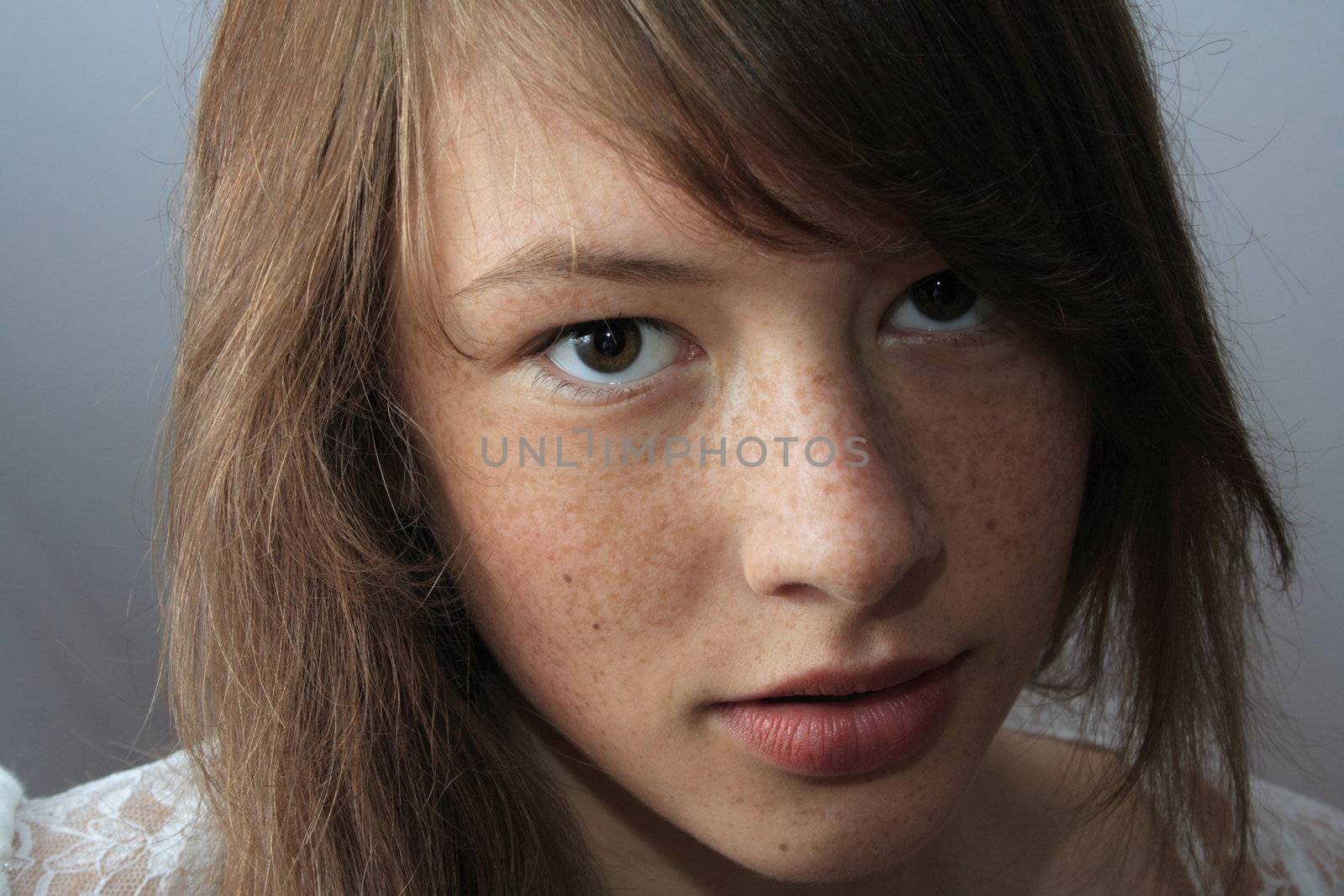 Portrait of cute young girl with freckles by BDS