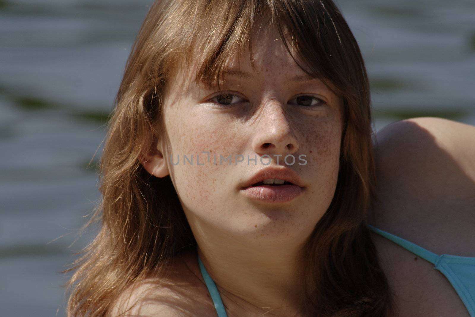 Portrait of cute young girl with freckles