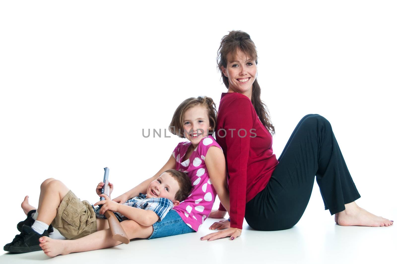 Beautiful family of a single mother with a son and daughter against a white background.