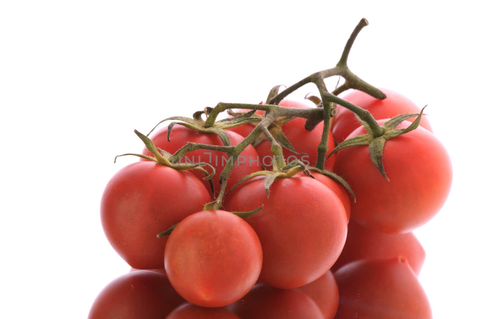 Red tomatos isolated on white background