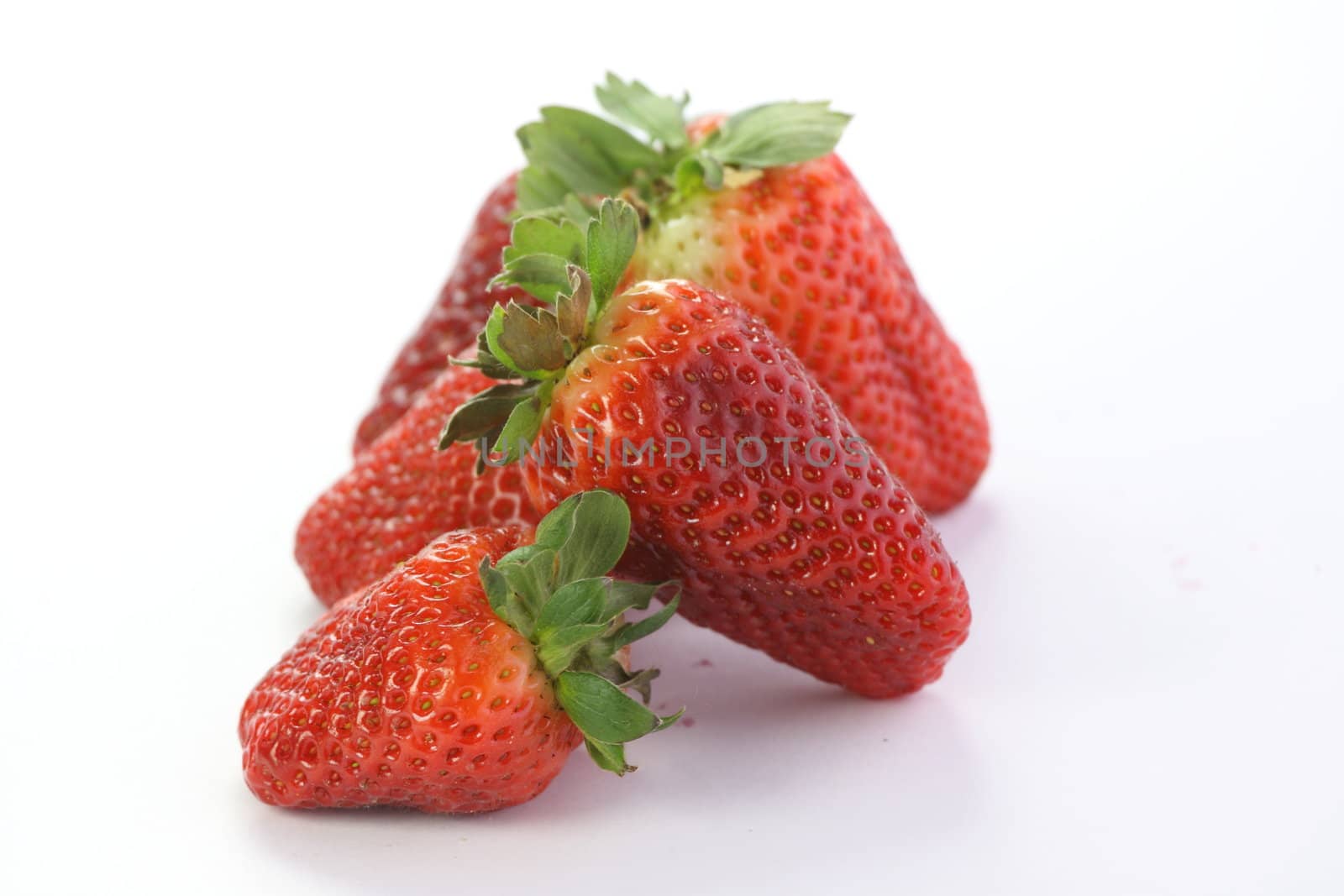 Strawberries over white background by BDS