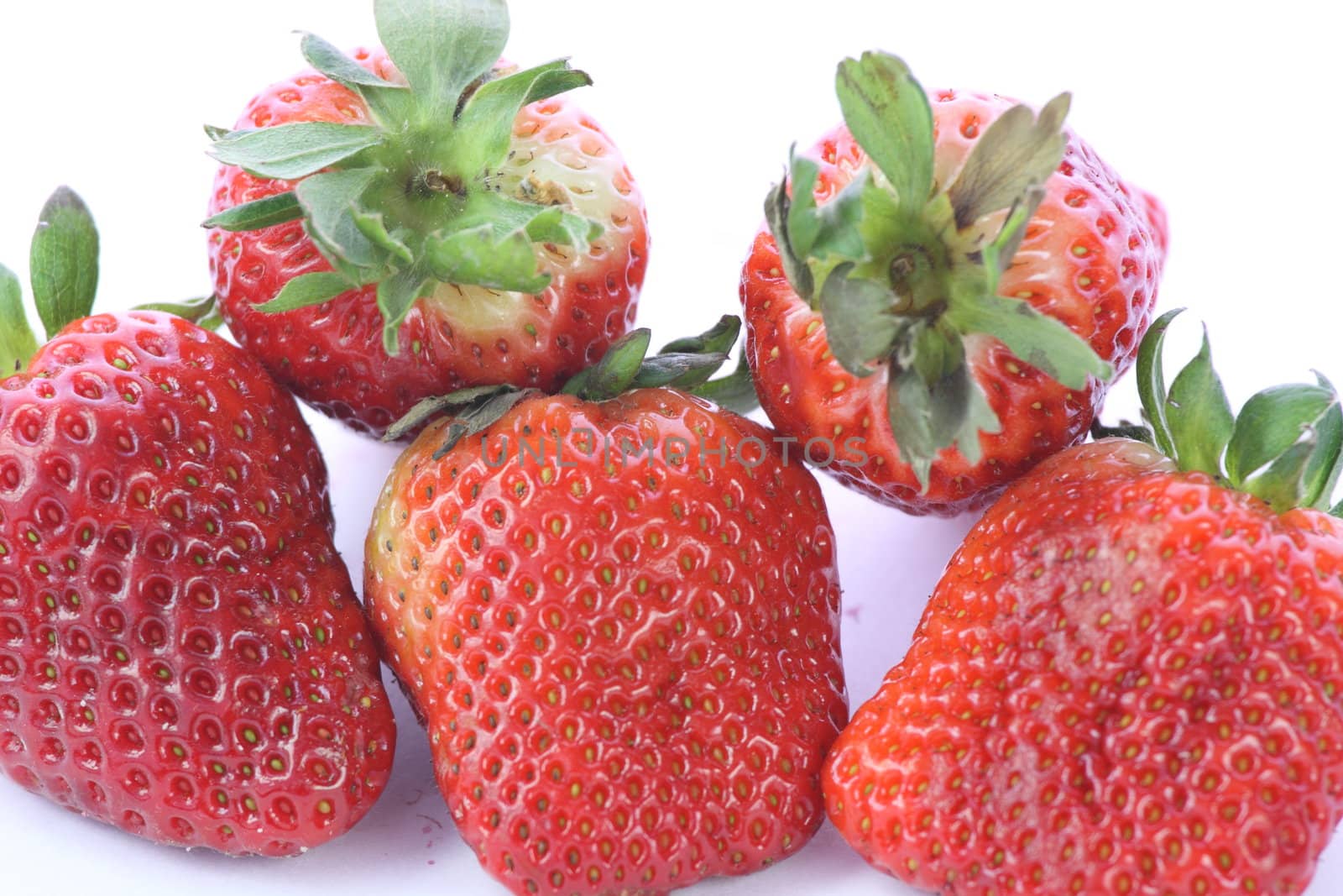 Strawberries over white background by BDS