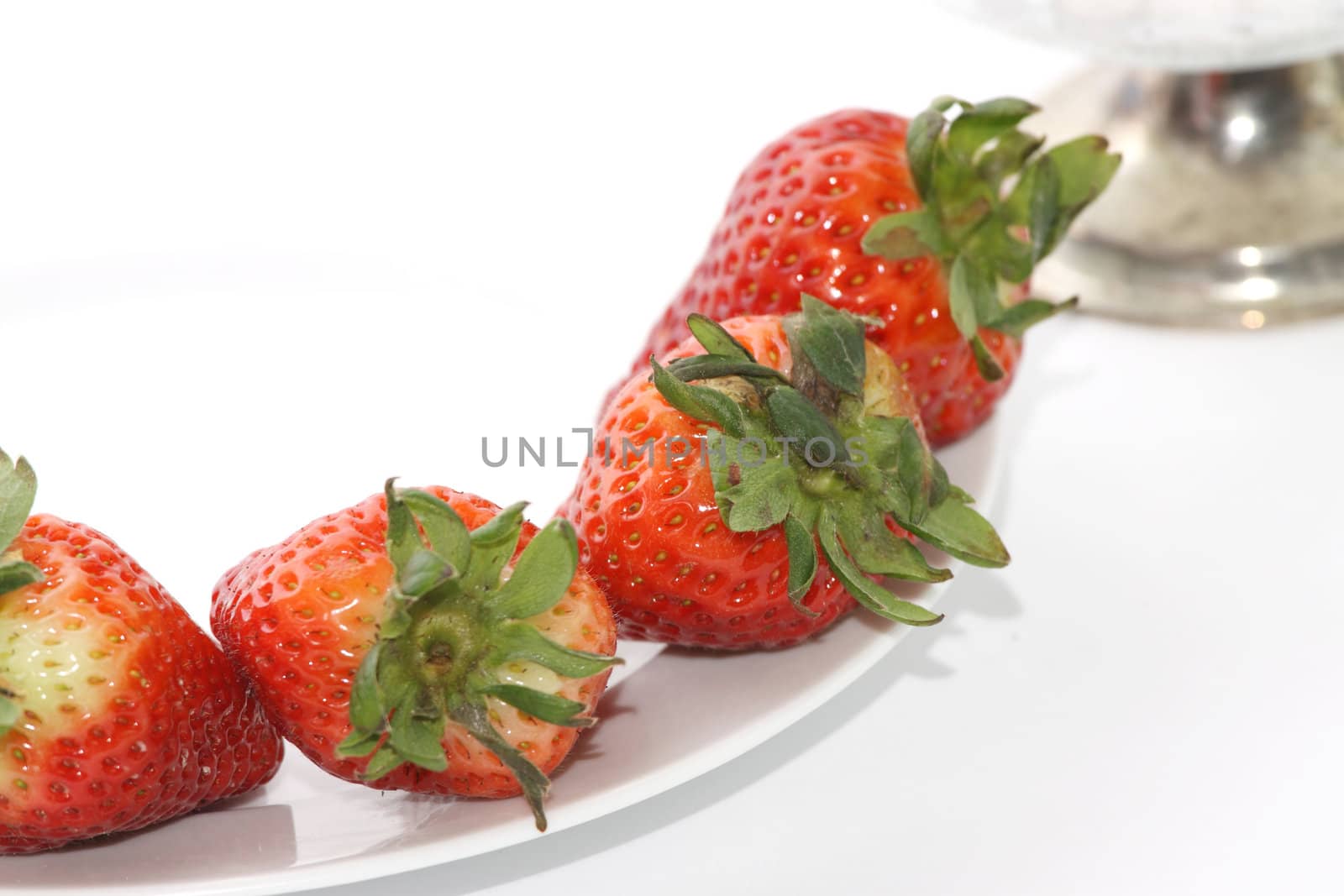 Fresh and tasty strawberries over white background