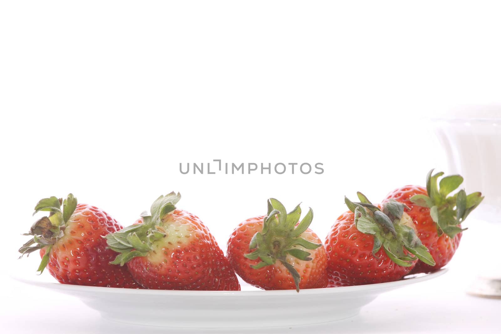 Strawberries over white background by BDS
