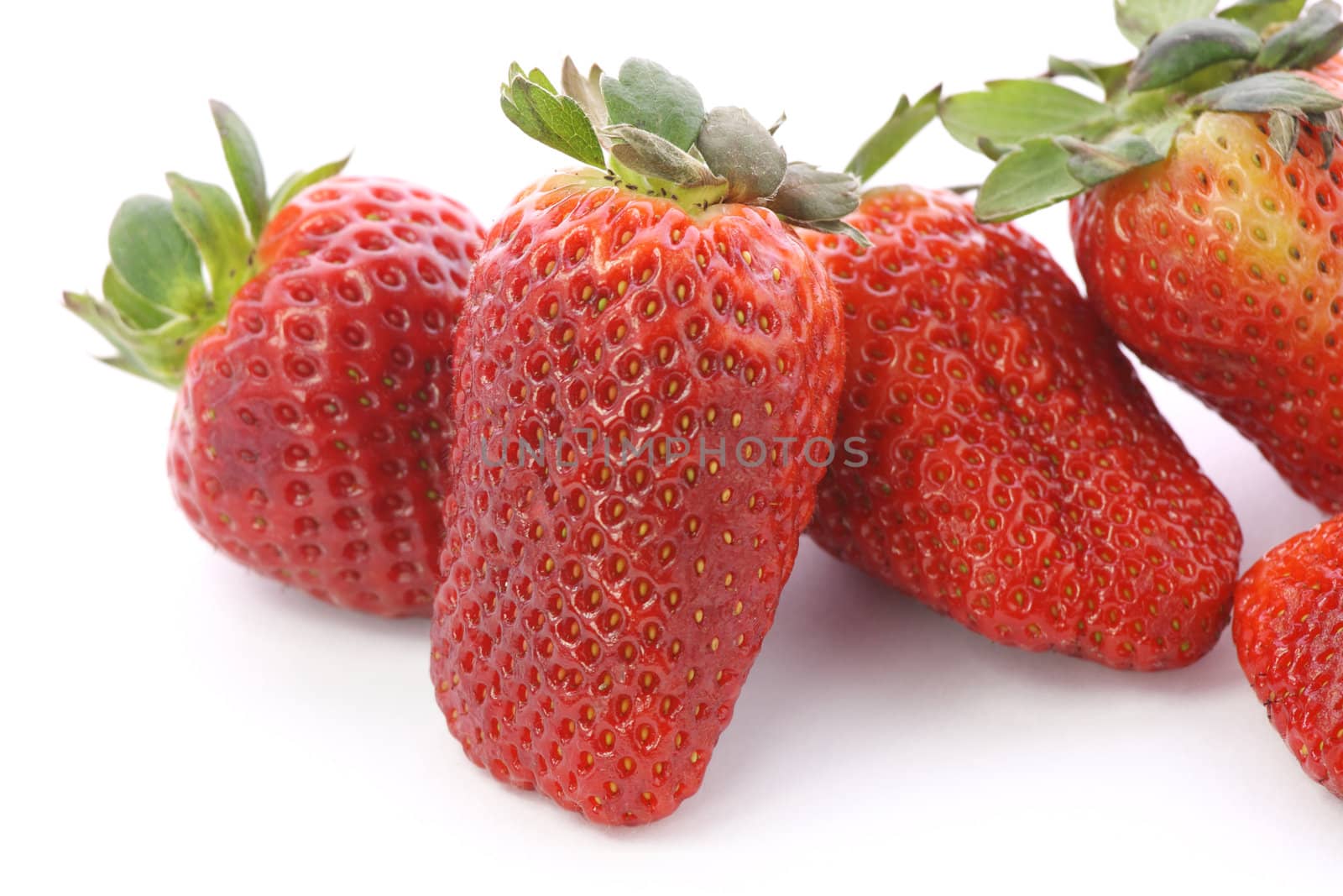 Strawberries over white background by BDS