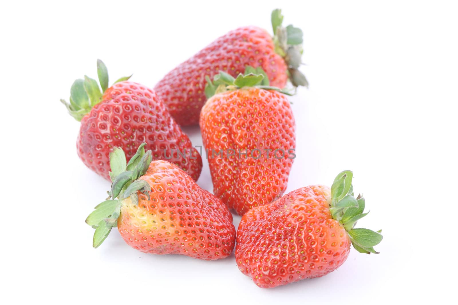 Strawberries over white background by BDS