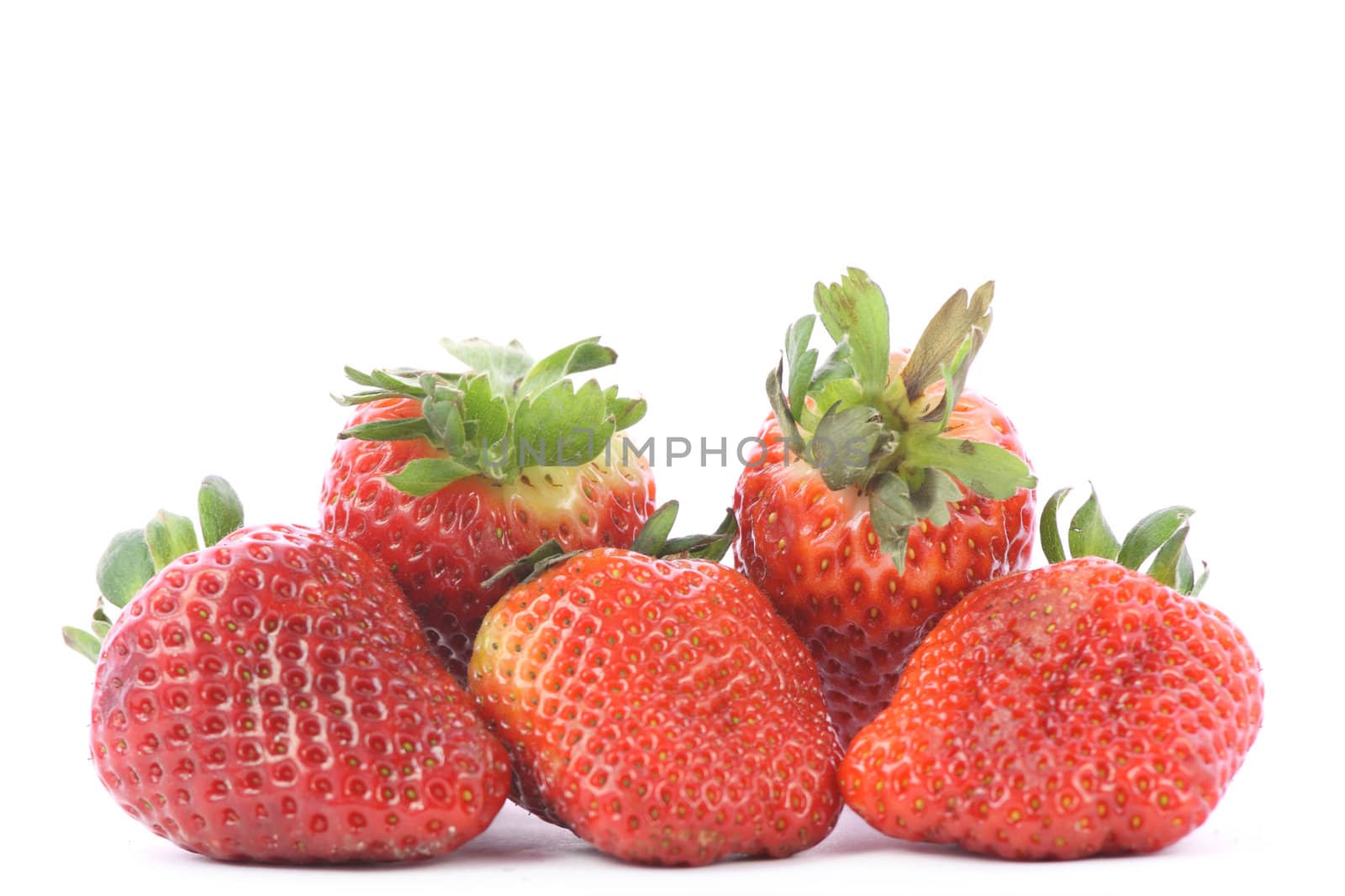 Strawberries over white background by BDS